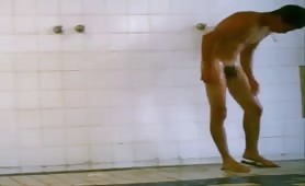 Spycam place in the locker room shower records an hot guy stroking his cock