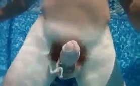Jerking off and cumming underwater in the swimming pool