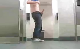 Gay college boy jerking his teen cock in the campus public restroom