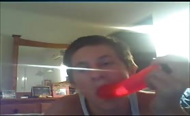 18 year old guy licking a red dildo