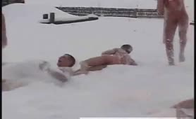 Russian guys play in the snow